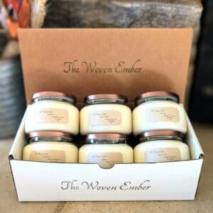A box of six candles with the words " the western candle ".