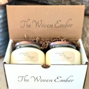 A box with two candles inside of it