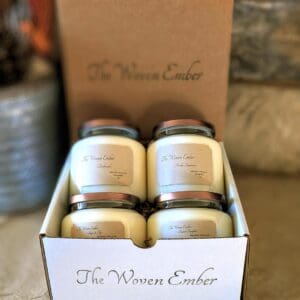 A box of candles sitting on top of the floor.