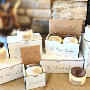 A table with several boxes of candles on it.